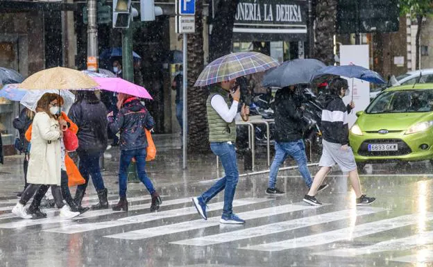 Several people walk in the rain in Murcia in an image from this week. 