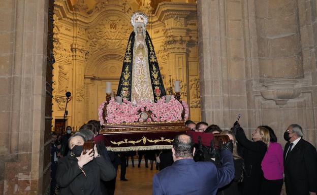 The Virgen de la Soledad carried by legal professionals on their way out in procession. 
