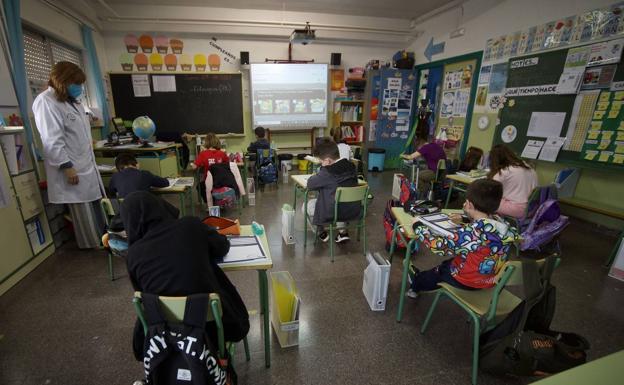 A teacher teaches a class at a school in Murcia in a file image. 