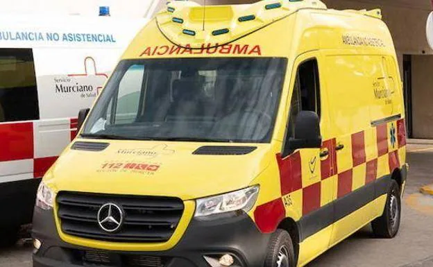 Stock image of an ambulance in front of a hospital. 