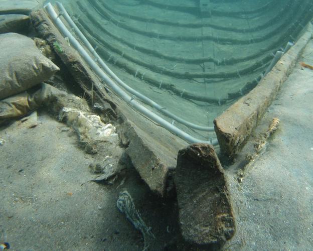 Hull of the Phoenician ship 'Mazarrón II', in the waters of La Isla beach, before being protected with a metal sarcophagus. 