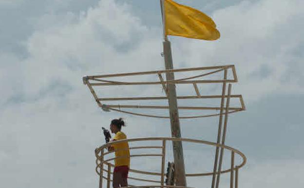 Yellow flag on a beach, in a file image.