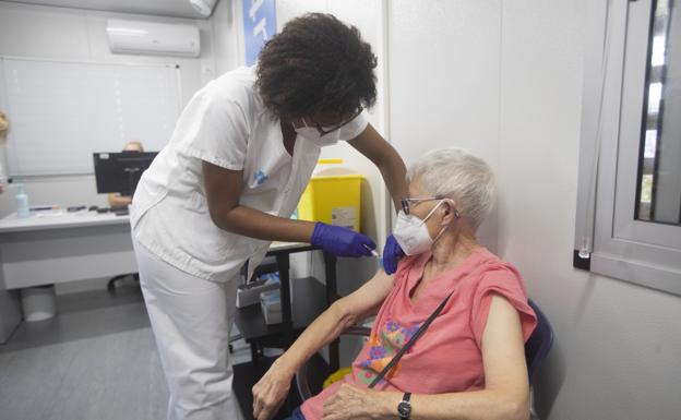 An elderly woman receives a vaccination in a file image. 