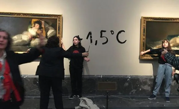 The two ecological activists glued to the frames of Goya's paintings in the Prado Museum.