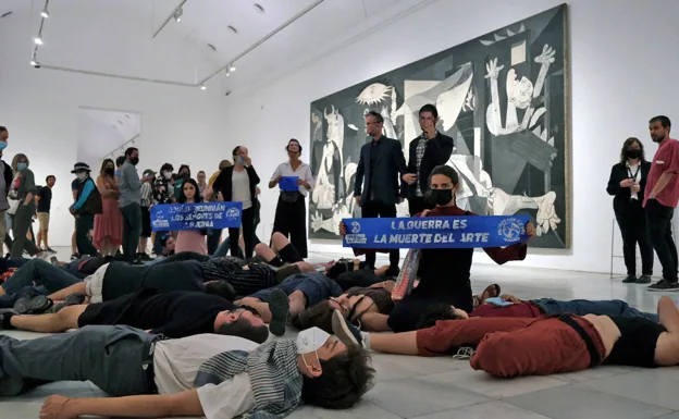 Members of 'Extinction Rebellion' protest in front of 'Guernica' during the NATO summit held in Madrid in June. 