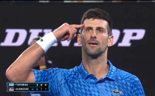 Djokovic puts his hand to his head after winning the Australian Open. 